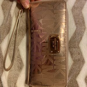 Beautiful rose gold MK wristlet